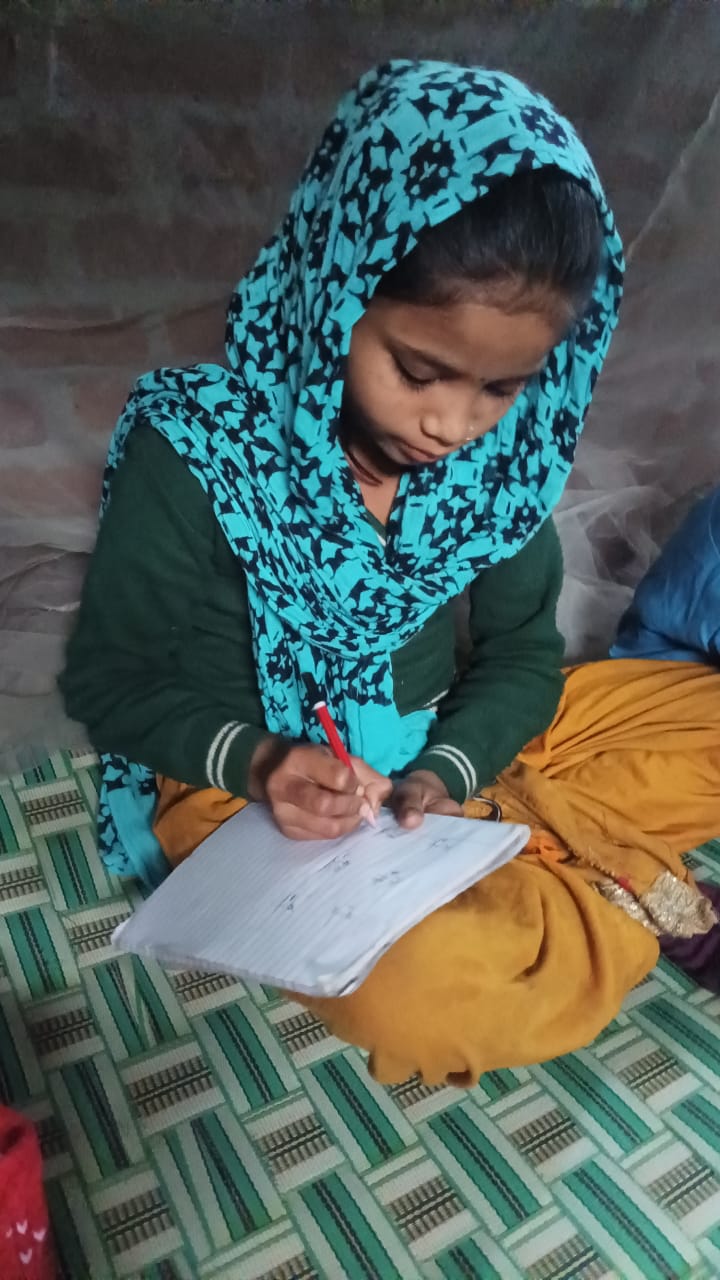 Dolly and Jagriti teaching children